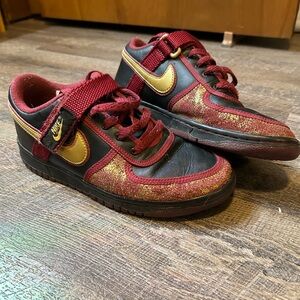 Nike sneakers. Size 6 youth/womens 8. Maroon, gold and black.